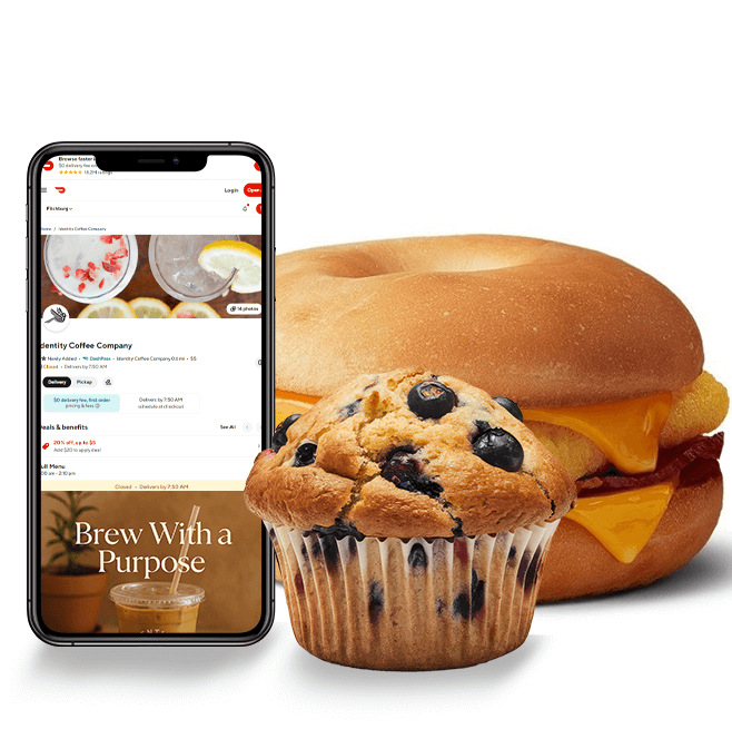 A photo of a phone with the door dash open and a blueberry muffin in front of an egg sandwich.